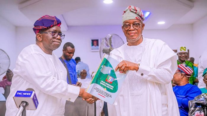 Former Governor Gboyega Oyetola, receiving a report from a 'Party Repositioning Committee' headed by Prof. Isaac Adewole to determine the root cause of the failures experienced by the party in recent elections under the former governor.