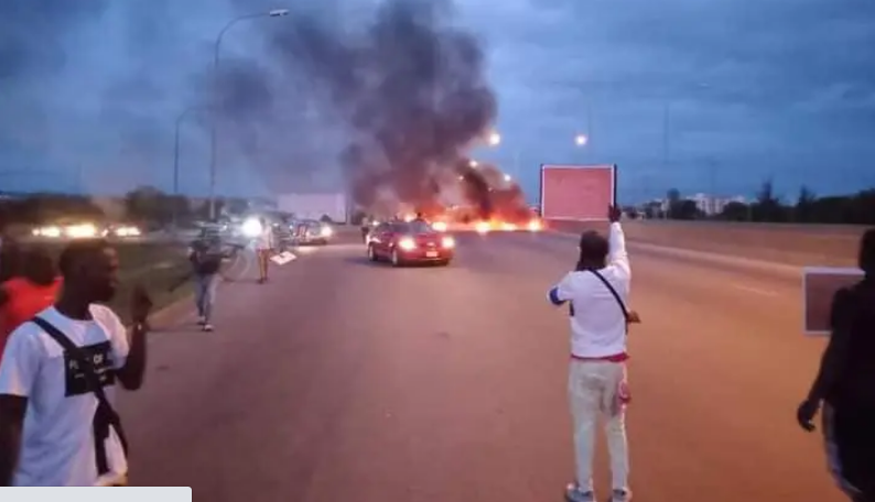 #BuhariMustGo Protesters Storm Abuja Block Airport Road